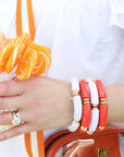 Orange lelani disc bracelet set of 2